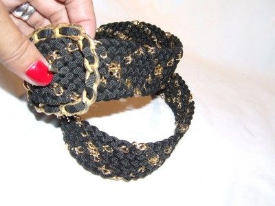 You are looking at beautiful black woven fabric with gold metal link 