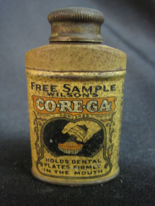 Co re ga,Wilson’s Sample,Corega Co.holds dental plate  